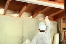 Technician installing insulation